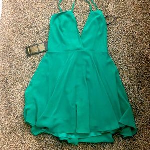 Green emerald mini dress with a slight flare.